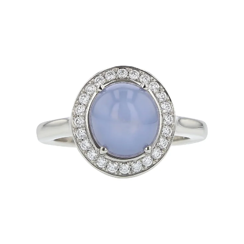 Women’s modern cut engagement rings-Cabochon Star Sapphire and Diamond Halo Ring