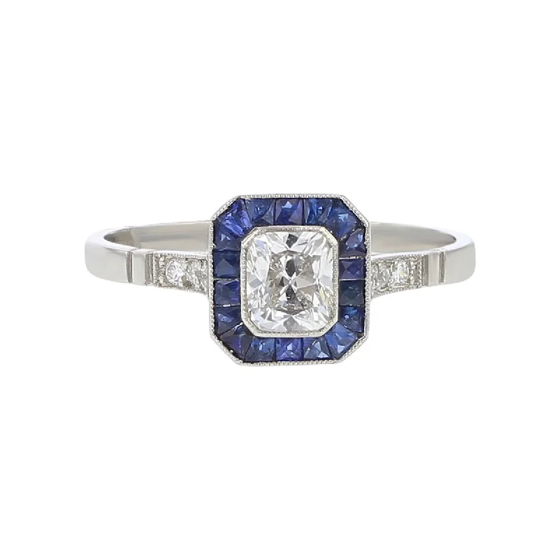 Women’s modern engagement rings-Platinum Radiant Diamond and Sapphire Halo Ring