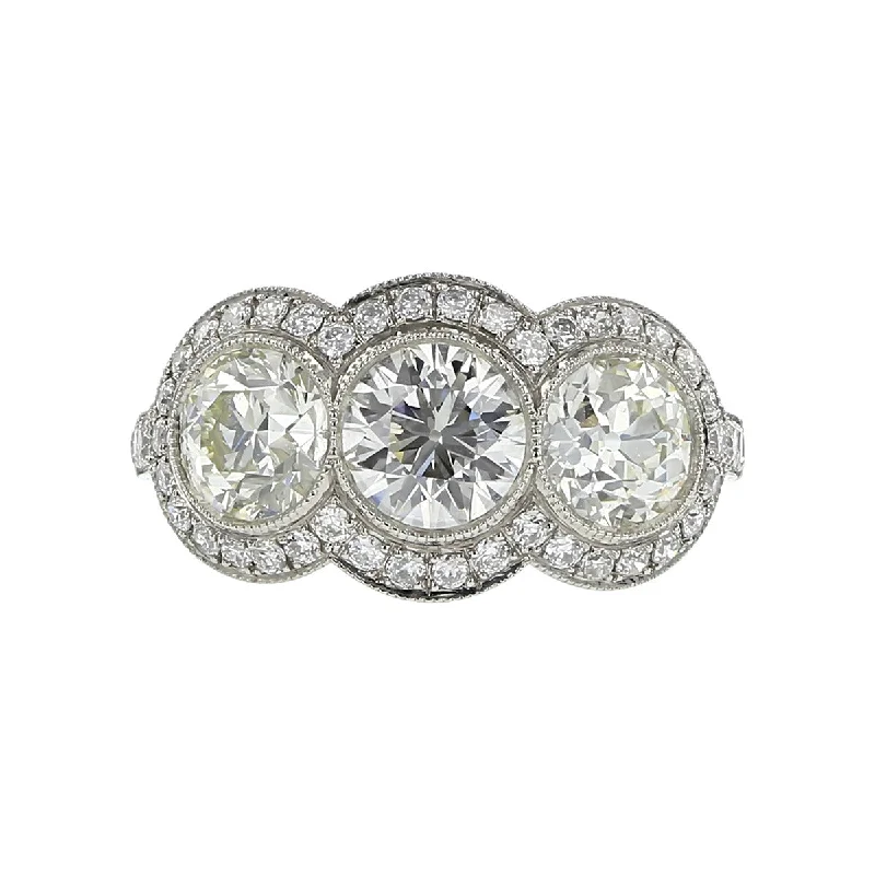 Women’s antique-style engagement rings-Platinum Old European-cut Diamond Triple Halo Ring