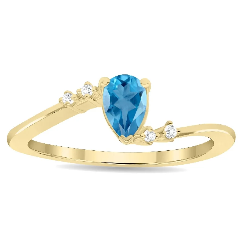 Women’s stacking wedding rings-Women's Pear Shaped Blue Topaz and Diamond Wave Ring in 10K Yellow Gold